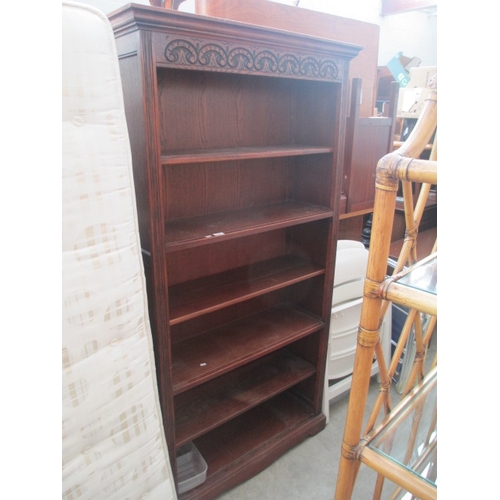 725 - A large vintage open carved oak bookcase/unit