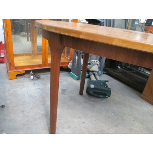 637 - A retro teak extending dining table by McINTOSH