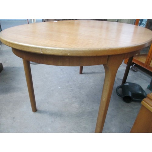 637 - A retro teak extending dining table by McINTOSH