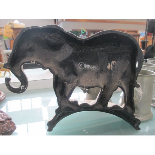 498 - Cast iron elephant door stop with Minster written on the back