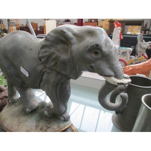 498 - Cast iron elephant door stop with Minster written on the back