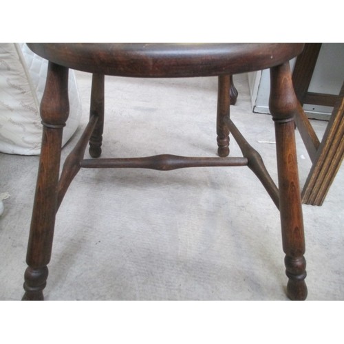 710 - A vintage wooden spindle back elbow chair with tapestry seat