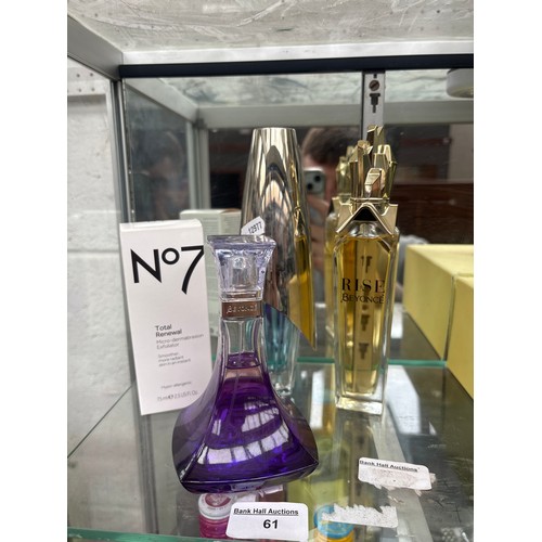 61 - Three assorted perfumes and exfoliator