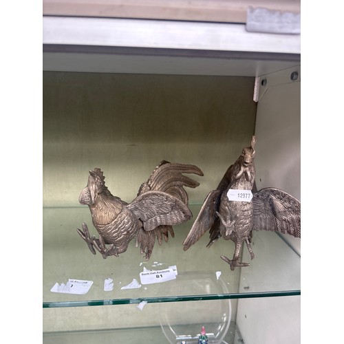 81 - Pair of white metal roaming roosters