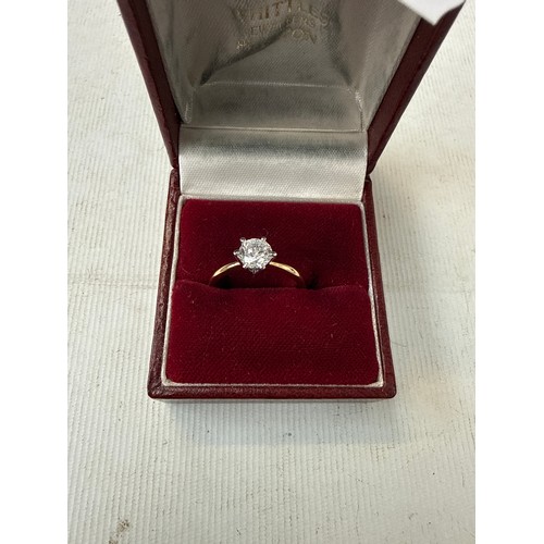 39 - Gold coloured ring with white stone