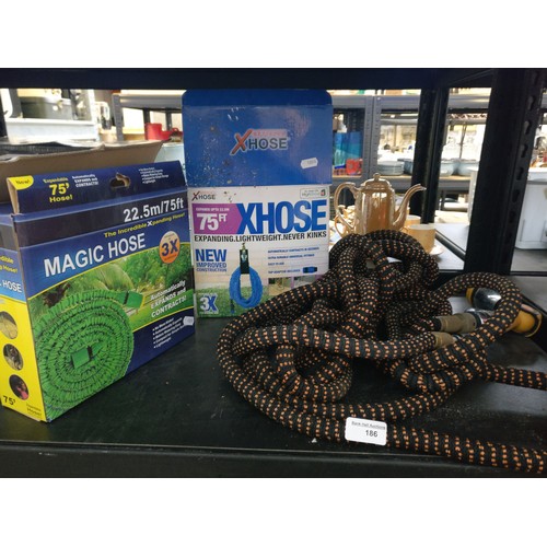 186 - Three assorted hosepipes