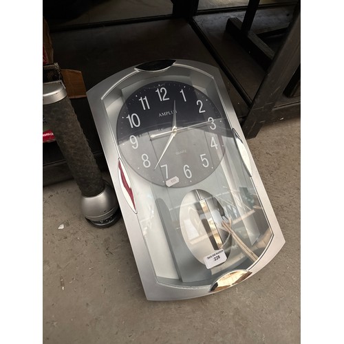 228 - Large clock and torch