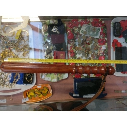 9 - Police helmet and truncheon