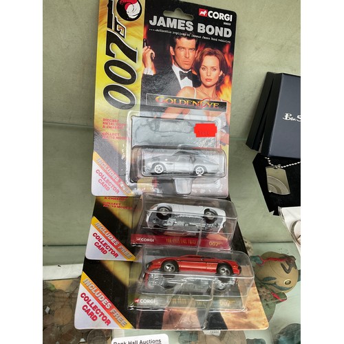 Three 007 model cars