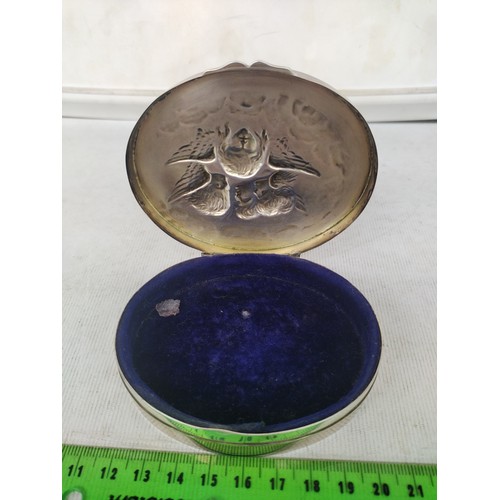 5A - Hallmarked silver trinket box with Putti design to top,

103.8 grams gross