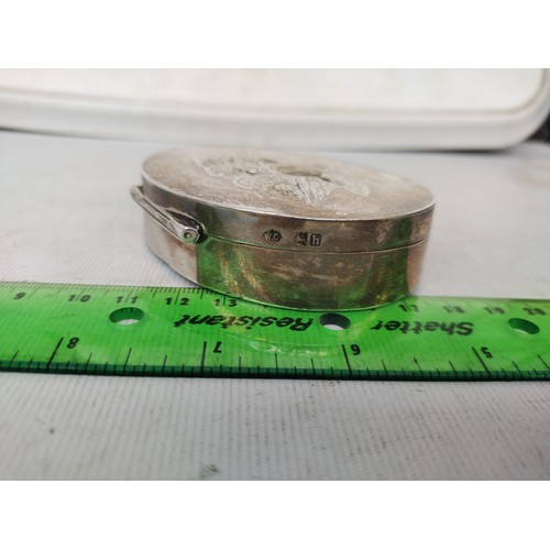 5A - Hallmarked silver trinket box with Putti design to top,

103.8 grams gross
