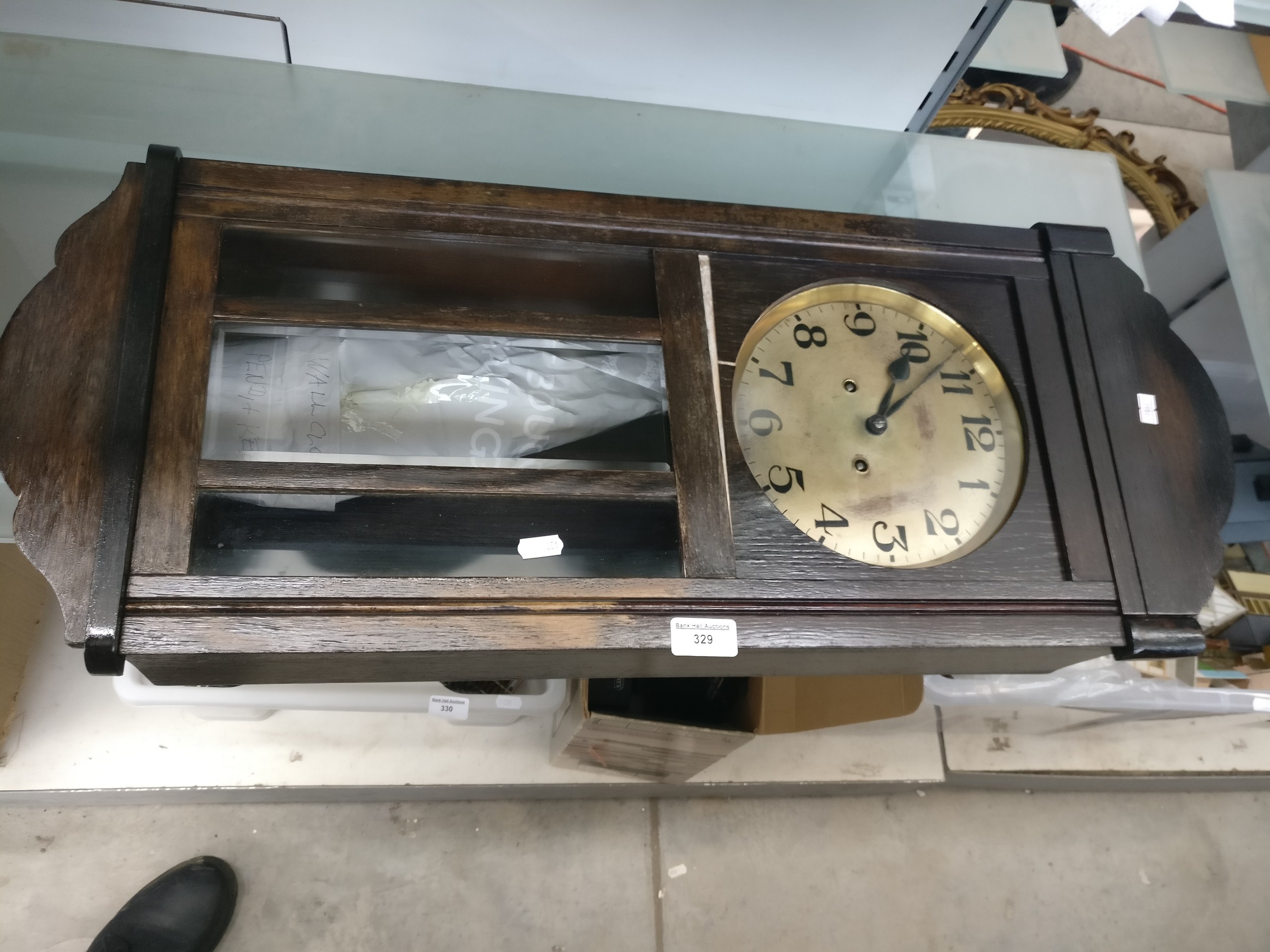 Vintage wall mounted clock with key and pendulum
