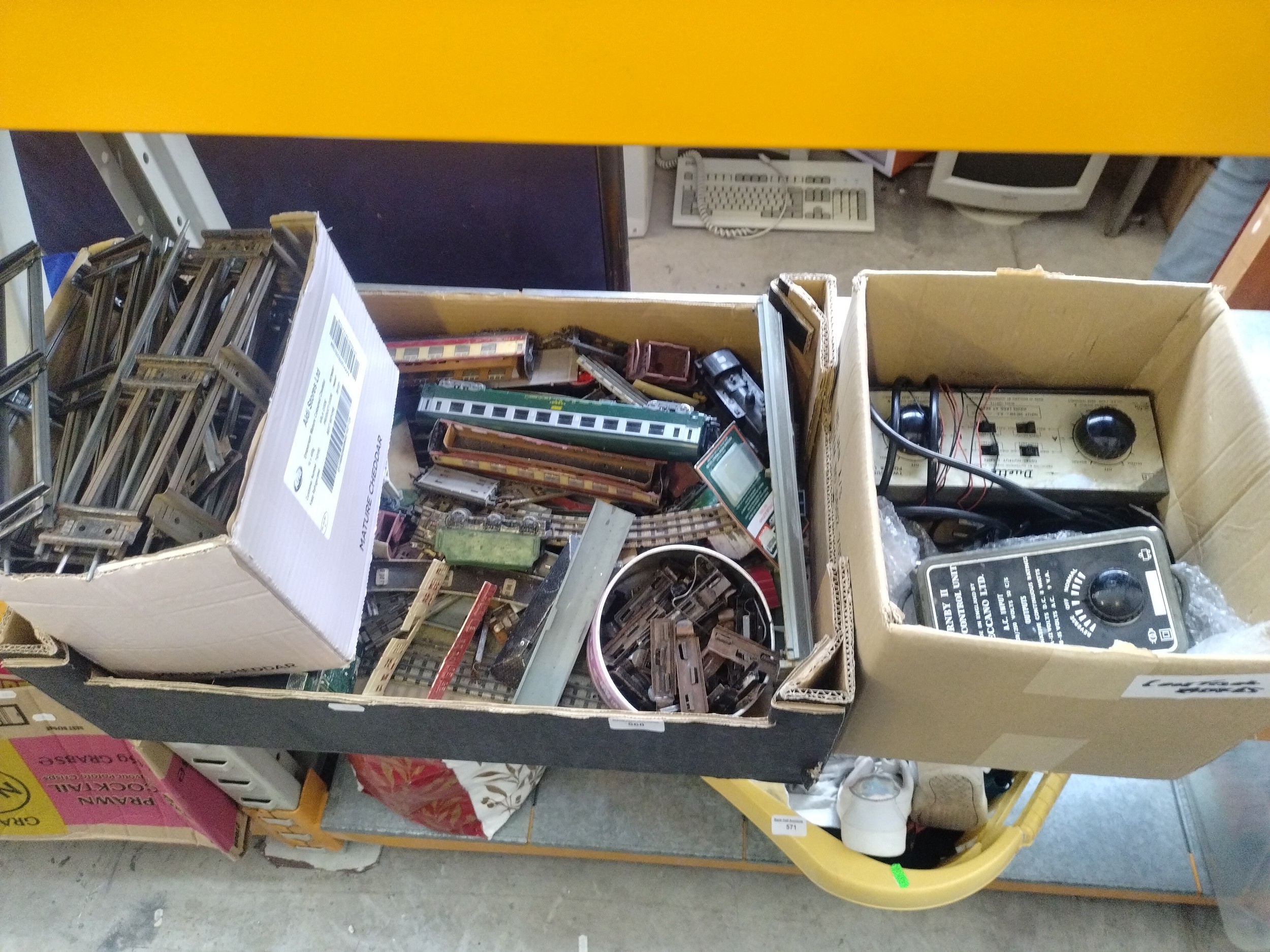 Three boxes inc model rail track, train carriages, power units, etc