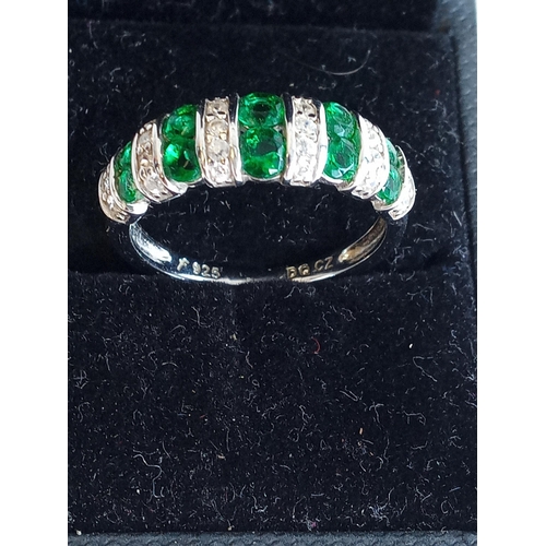 105 - Ladies Silver Ring with Green & Clear Stones, size O