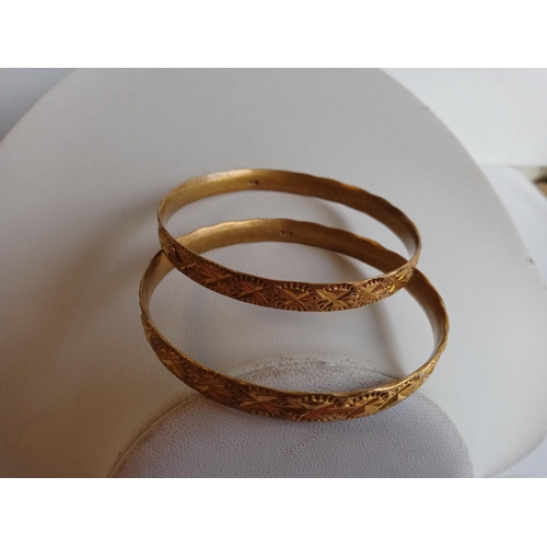 123 - 2 Yellow Metal Bangles