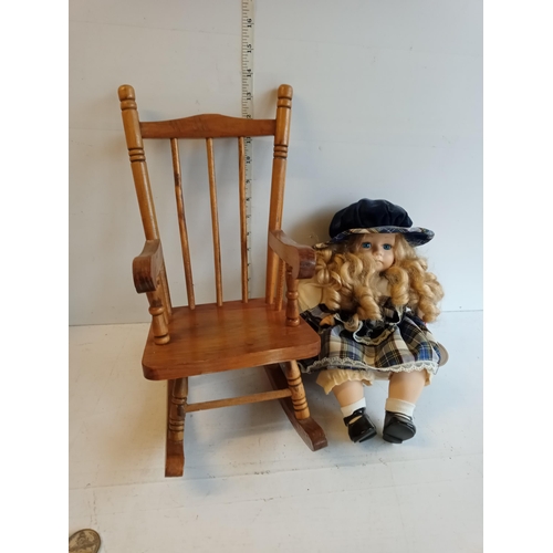 153 - Doll & a Wooden Rocking Chair