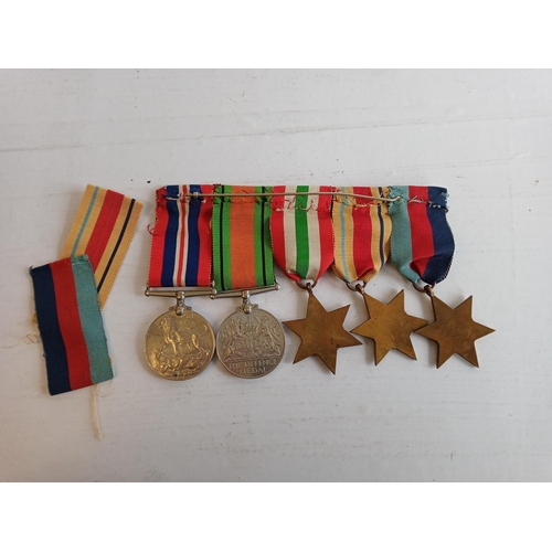 179 - Group of WW2 Medal with African Star, Italian Star & a War of Victory Medal with 8th Army Bar