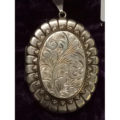 27 - Very Large Nicely Decorated Silver Locket