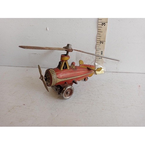 64 - Tin Plate Clockwork Aeroplane