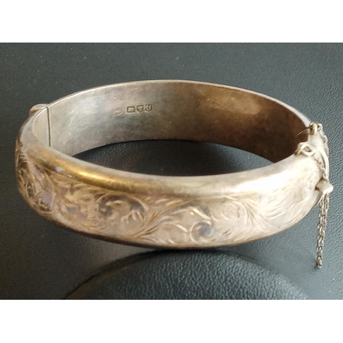 130 - Highly Decorated Silver Hinged Bangle,25.55 grams