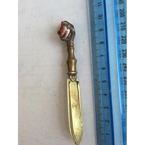 149 - Yellow Metal with Red & White Stone Claw Book Mark