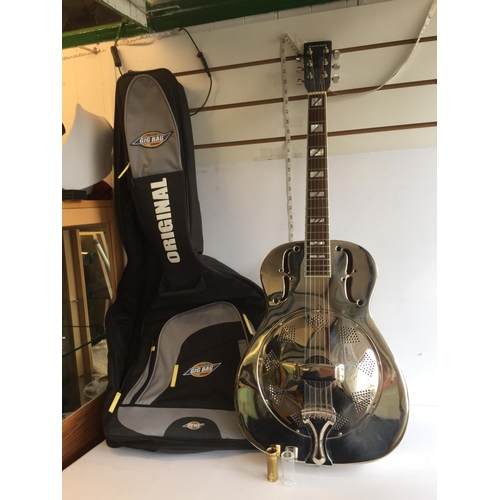 286 - Antoria Brass Bodied Resonator Guitar with 2 Bottle Necks.
In Lovely Condition and with Case.
Shippi... 