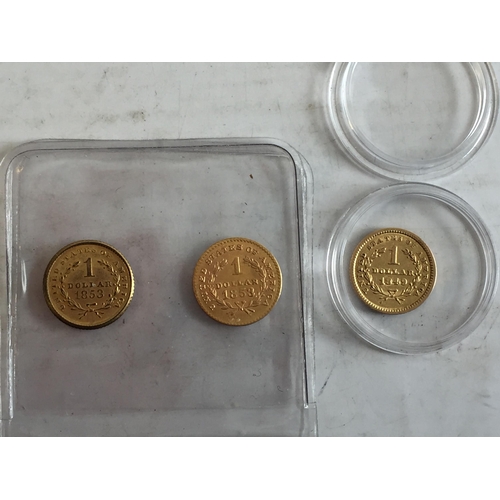 258 - US 22ct  Gold Dollar & 2  Replica Dollars.