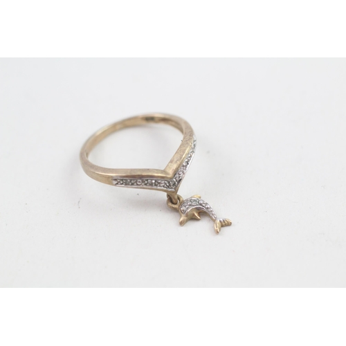 22 - 9ct gold diamond set floating dolphin wishbone ring