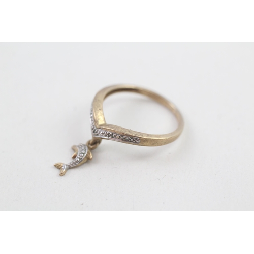 22 - 9ct gold diamond set floating dolphin wishbone ring