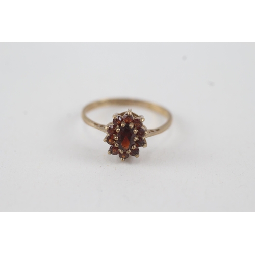 35 - 9ct gold garnet oval cluster ring