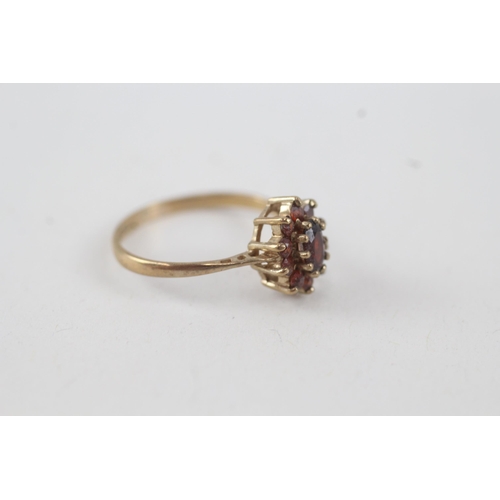 35 - 9ct gold garnet oval cluster ring