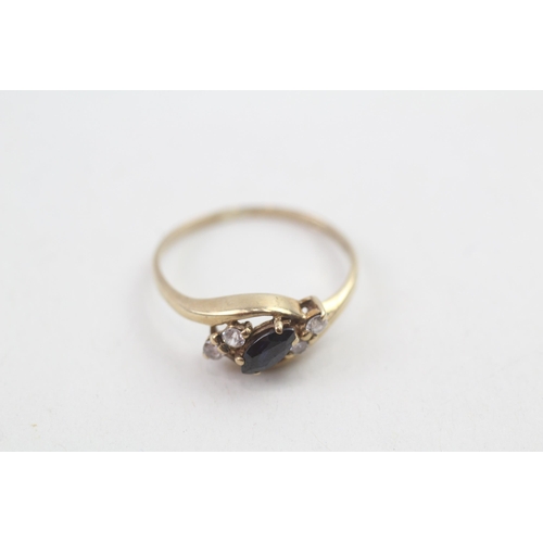 6 - 9ct gold sapphire & white gemstone dress ring