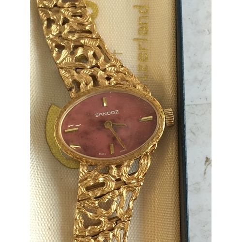 191 - Gold Tone Sandoz Wrist watch in original Box
