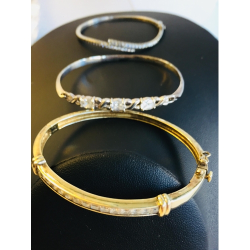 126 - Collection of Sterling Silver Cubic Zirconia Bangles Inc Bypass x 3.


2024254