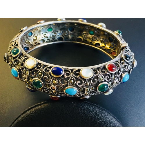 141 - Sterling Silver Multi Gemstone & Marcasite Bangle inc Garnet.


2024220