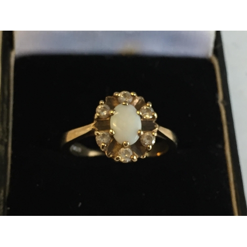 44 - 9ct Gold Opal & Cubic Zirconia Cluster Ring, size O.


2058055