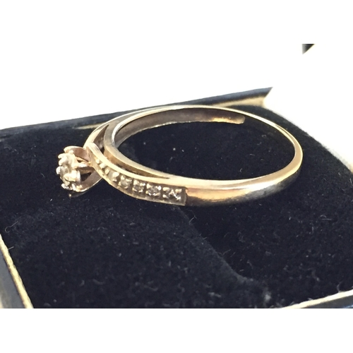 55 - 9ct Gold Diamond Twist Single Stone Ring, size R.



2098424