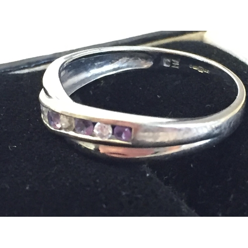 70 - 9ct White Gold Cubic Zirconia & Amethyst Set Cross Over Ring, size P.


2055405