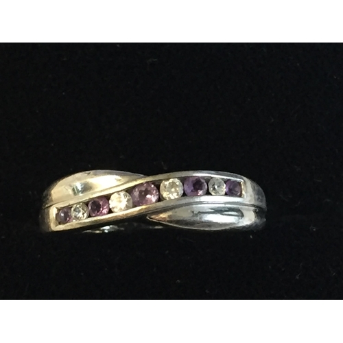 70 - 9ct White Gold Cubic Zirconia & Amethyst Set Cross Over Ring, size P.


2055405