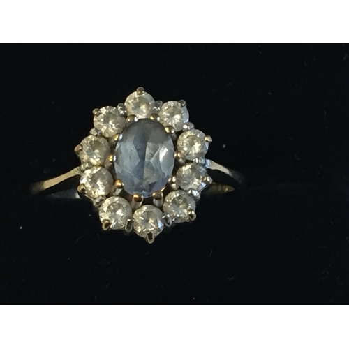 76 - 9ct Gold Blue Gem Stone Halo Ring, size N 1/2.


2008477