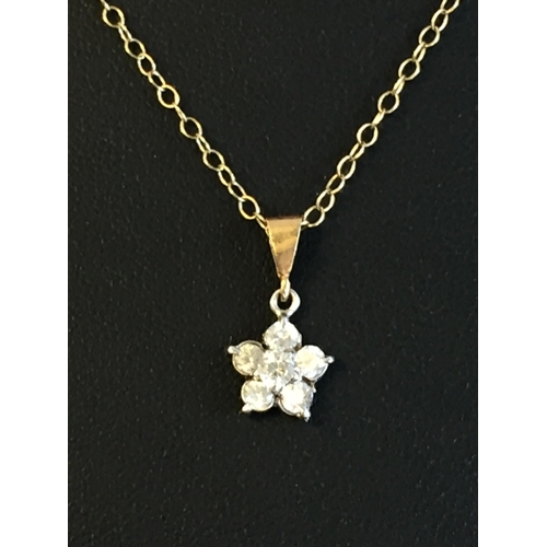 185 - 9ct Gold Cubic Zirconia Set Floral Pendant with Chain, 1.7grams


2055337