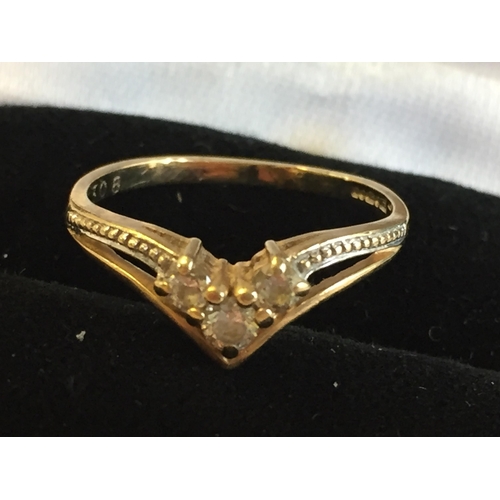 186 - 9ct Gold Cubic Zirconia Set Wishbone Ring, size L 1/2.



2055400