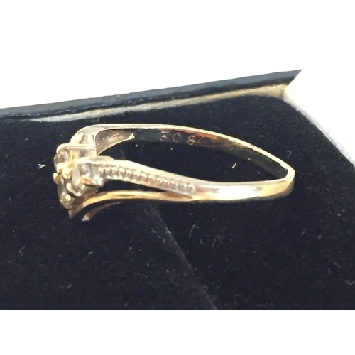 186 - 9ct Gold Cubic Zirconia Set Wishbone Ring, size L 1/2.



2055400