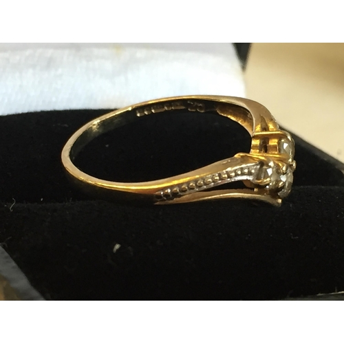 186 - 9ct Gold Cubic Zirconia Set Wishbone Ring, size L 1/2.



2055400