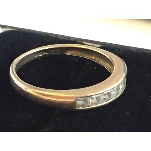 190 - 9ct Gold Channel Set Cubic Zirconia Seven Stone Eternity Ring, size N.


2055401