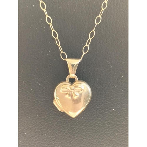 197 - 9ct Gold Heart Shape Locket Pendant Necklace,

2029581