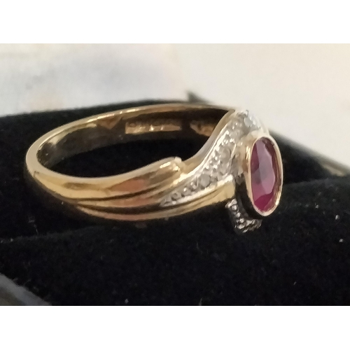 1 - 9ct Gold & Ruby, 25 points & Diamond Chip, size M