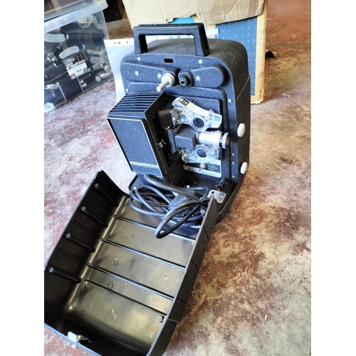 188 - A Bell & Howell Auto Load 18mm Projector in Original Box, Shipping Unavailable.

569258