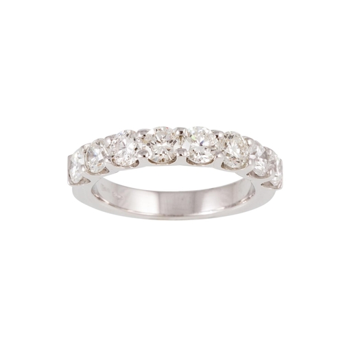 102 - AN EIGHT STONE DIAMOND RING, the brilliant cut diamonds mounted in 18ct white gold. Estimated; weigh... 