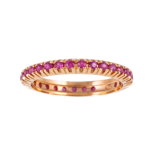 105 - A RUBY ETERNITY RING, the circular stones mounted in 18ct yellow gold. Estimated; weight of rubies; ... 